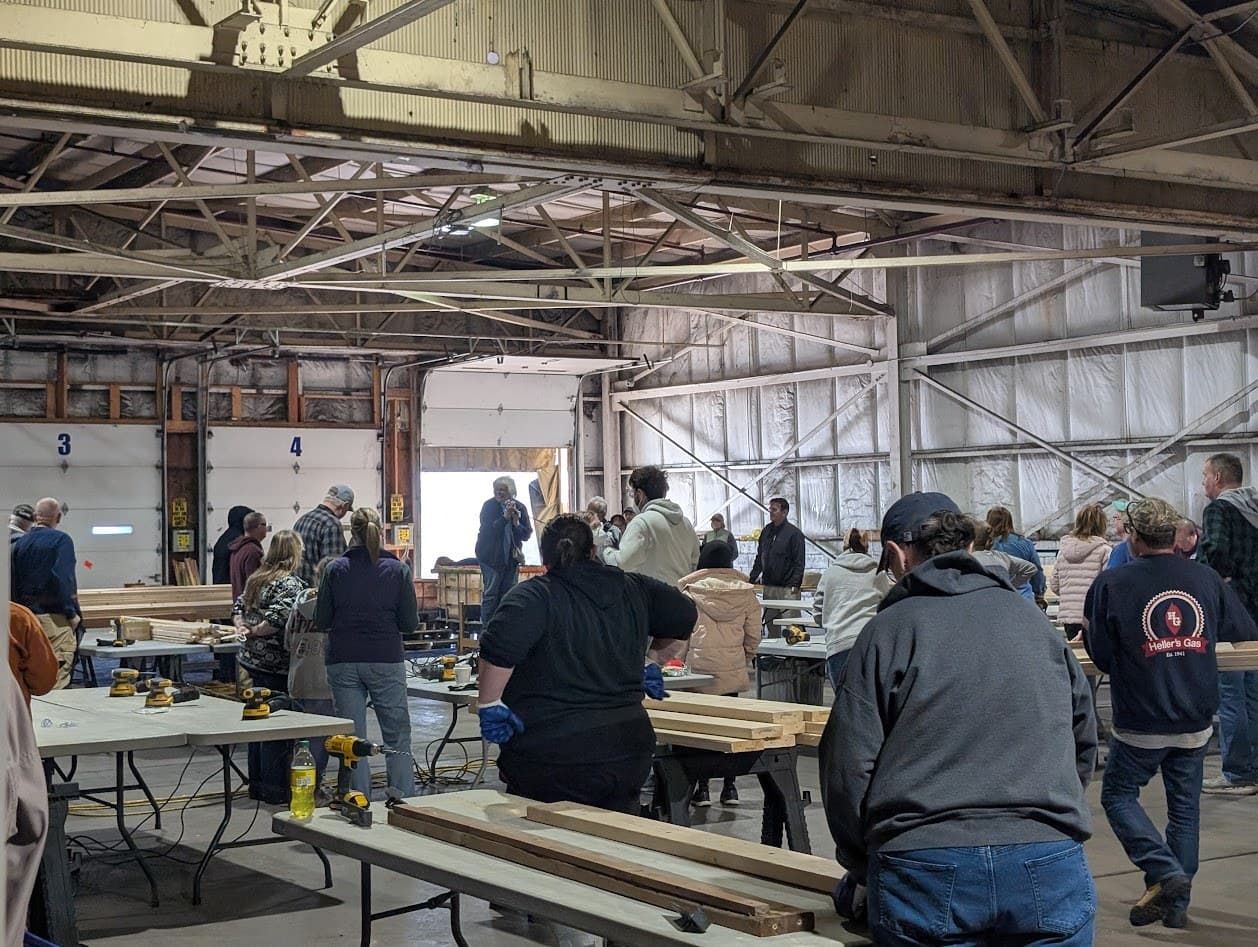 Community volunteers working across the bed-build stations
